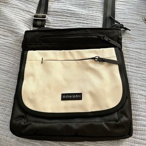 SHERPANI black and white crossbody with black and gray strap & lots of pockets